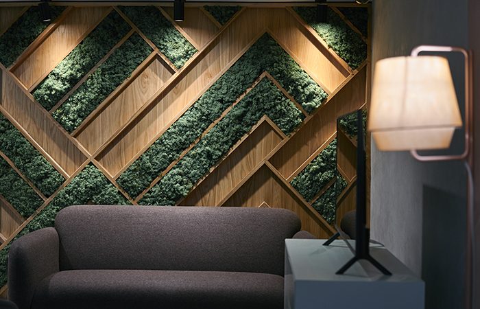 Design Insider Feature moss and oak wall with subtle lighting - entrance lobby